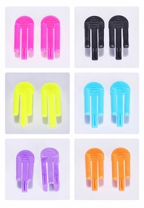 Close-up of candy-colored plastic trash bag clips in six vibrant assorted colors