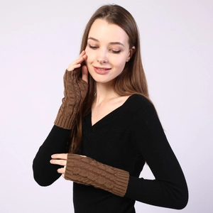 Detail of cable knit pattern and fingerless design on warm coffee brown arm warmers