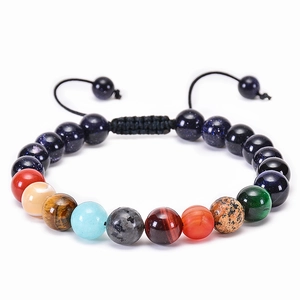 Detailed close-up of solar system beads bracelet with blue sandstone and natural stones