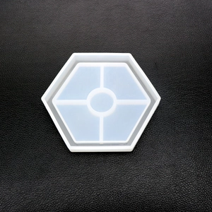 Macro view of hexagonal silicone mold with five compartments for DIY resin coasters