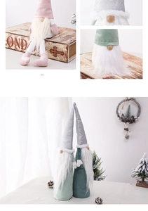 Close-up of plush Christmas gnomes with silver sequin hats and long faux fur beards