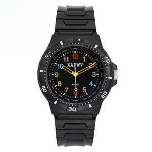 Detail view of large Arabic numerals on a black sports watch dial with elastic band