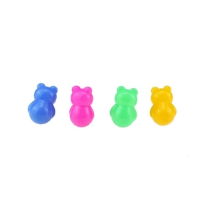 Close-up of four colorful cartoon animal tumblers in blue, pink, green, and yellow