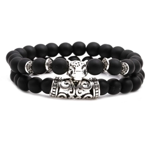 Matte black stone bead bracelet set with silver jaguar head and totem metal tube accents
