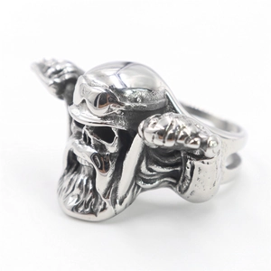 Macro shot of stainless steel biker ring featuring a detailed skull with helmet and beard