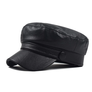 Detailed top view of black leather military flat top cap with smooth finish and curved visor