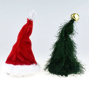 Detail of plush red Santa hat with star and green fringe Christmas tree hat with bell