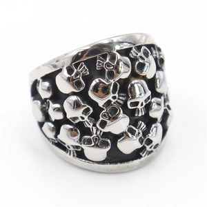 Gothic stainless steel ring featuring detailed all-over skull reliefs in a silver finish