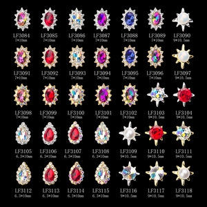 Assorted K9 crystal nail art charms with colorful rhinestones in gold and silver settings