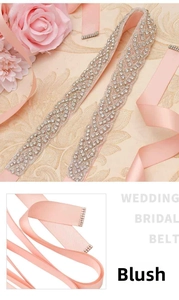 Detail of hand-sewn sparkling rhinestones on a smooth blush pink satin bridal belt