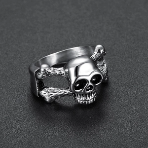 Macro shot of silver gothic skull and crossbones ring with polished stainless steel finish