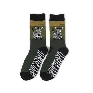Detail of adult mid-calf socks with dark green knit and zebra pattern with yellow accents