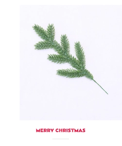Detailed view of artificial green pine needle branch for Christmas DIY decor on white background