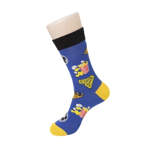 Detail of blue mid-calf socks with popcorn movie theme print and yellow contrast heel
