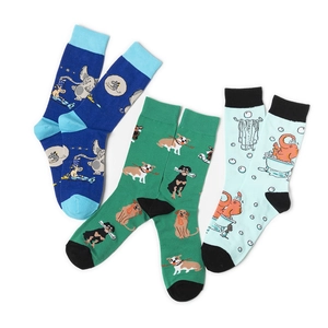Detailed view of three pairs of mid-calf socks with elephant and dog animal patterns