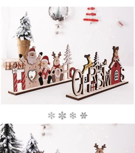 Detail of wooden HO HO HO and CHRISTMAS signs with Santa, snowman and reindeer motifs