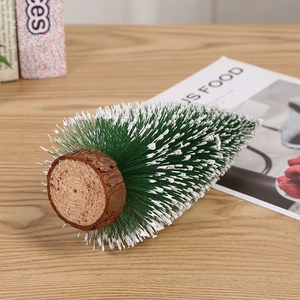 Mini artificial green sisal Christmas tree with white snow tips and natural wood base