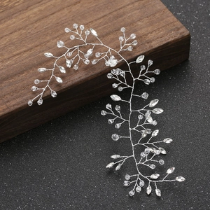Handmade bridal hair vine with silver wire and transparent crystals on wooden stand