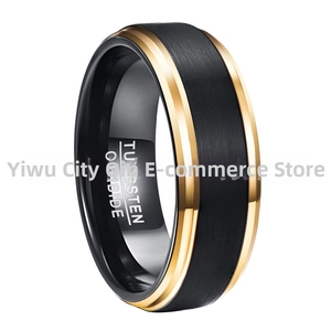 Detail view of black brushed tungsten ring with polished gold edges and engraved inner band