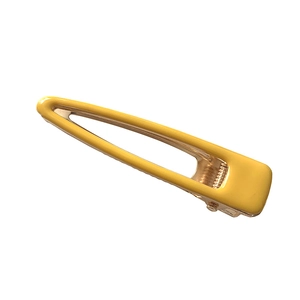 Fermaglio per capelli giallo minimalista con finitura metallica su sfondo bianco