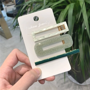 Set di tre fermagli per capelli color caramella con motivi marmorizzati e glitterati