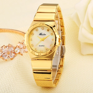 Elegant gold quartz watch with mother of pearl dial and crystal markers on soft fabric