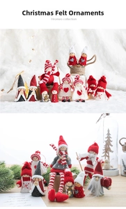 Detailed close-up of handmade Christmas wool felt dolls with festive hats and red heart charms