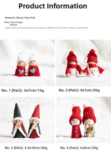 Detail view of handmade Christmas wool felt angels with wood accents and red hats