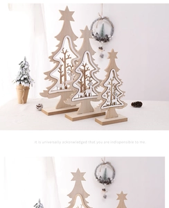 Detail view of wooden Christmas tree ornaments with deer silhouettes and warm lighting