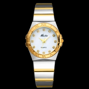 Close-up of mother-of-pearl watch face with diamond markers and two-tone steel band
