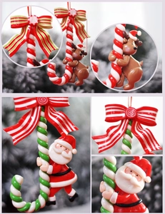 Detail of polymer clay candy canes with Santa and reindeer motifs for Christmas tree decor