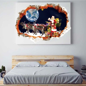 3D space Christmas wall sticker with Santa and reindeer over a bedroom headboard