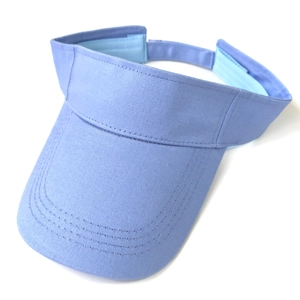 Detail shot of light blue cotton sun visor hat with precise stitching on the brim