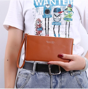 Brown faux leather long wallet with wristlet strap and white text logo detail