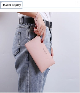 Pink long wristlet wallet featuring textured leather and Forever Young printed logo