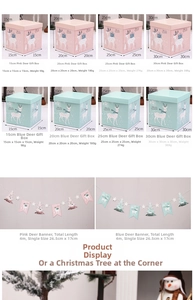 Detailed view of pink and blue Christmas gift boxes with reindeer and snowflake patterns