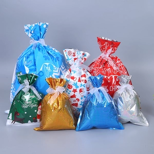 Festive Christmas drawstring gift bags in assorted metallic colors and various sizes