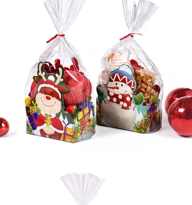 Detailed view of Christmas gift bags with reindeer and snowman patterns for apples