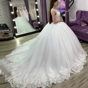 Elegant white lace ball gown wedding dress with long luxury train and sweetheart bodice