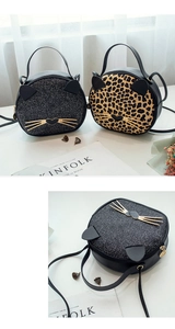 Close-up of cat-shaped crossbody bags featuring black sequins and leopard print details