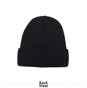 Macro view of black ribbed knit beanie back showing soft texture and folded cuff detail
