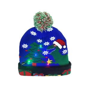 Detail of LED knit hat with blue dinosaur patterns and built-in colorful lights