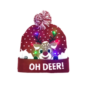 Close-up of LED Christmas knit hat with reindeer pattern and glowing lights