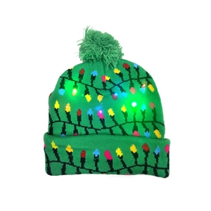 Close-up of green Christmas beanie with integrated colorful LED lights and pom-pom
