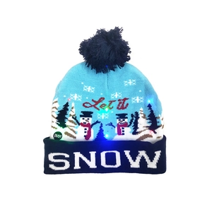 Detail of LED Christmas knit hat with Let it SNOW text and on-off switch button