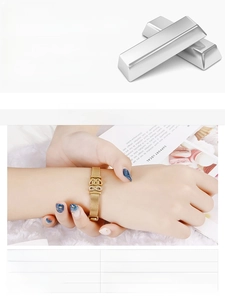 Detail of gold stainless steel mesh bracelet with sparkling heart and infinity symbols