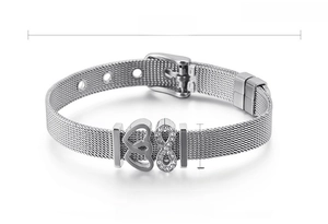 Detail view of 8mm stainless steel mesh bracelet with heart and infinity zircon charms