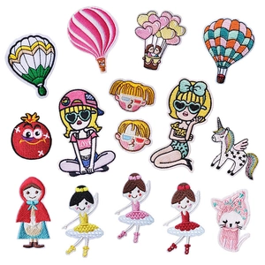 Detailed macro view of colorful embroidered patches with fine stitching on white background