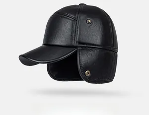 Detailed close-up of a premium black leather winter hat with earflaps and metal hardware