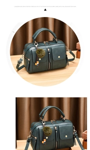 Detail shot of green PU leather pillow bag showing litchi texture and plush ball charm